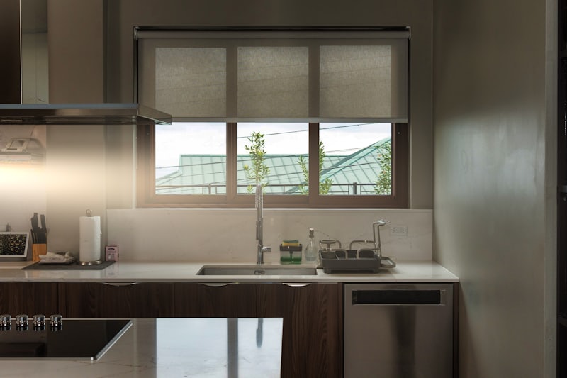 A quiet kitchen in the morning, light coming through the window over the sink.